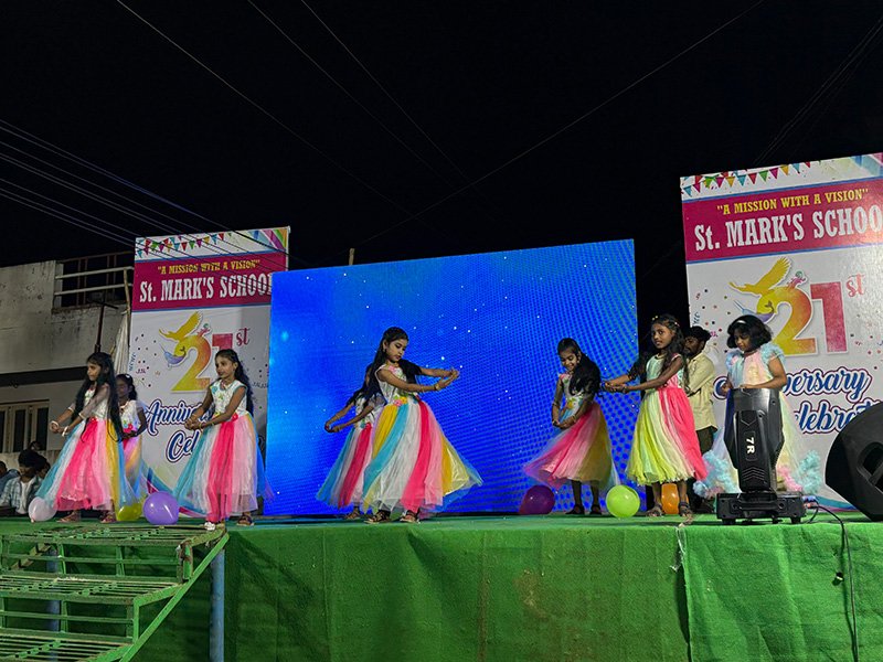 School children performing on stage