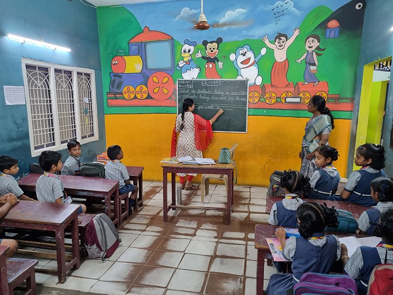 Classroom teacher by board